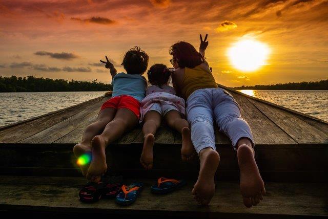Family at sunset in Cambodia