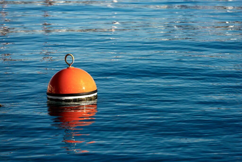 A buoy in the sea provides a sustainable alternative to anchors