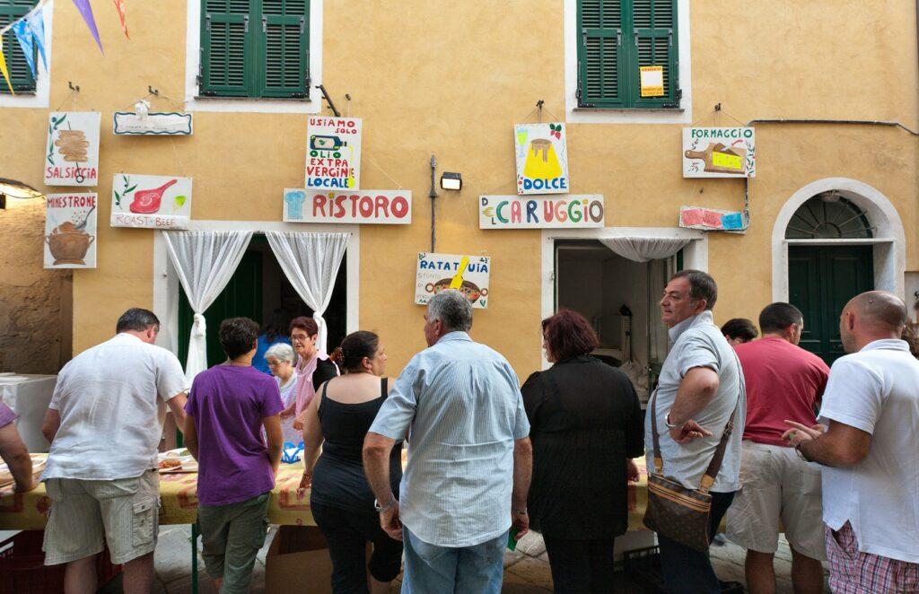 People on the beach in the Italian village of Borgomaro.