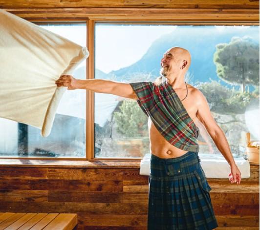 Sauna master Istvan waving the towel in the sauna
