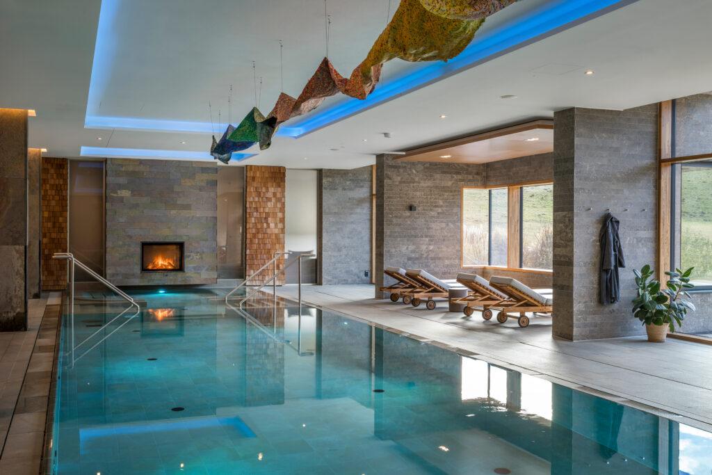 Swimming pool at Hotel Klosterhof Alpine Hideaway & Spa after "Glow Up" with Kunstwerkt - Regenbogenweg