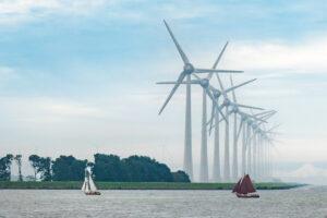 Wind turbines, boats, sustainable vacations, and renewable energies. Quelle: iStock