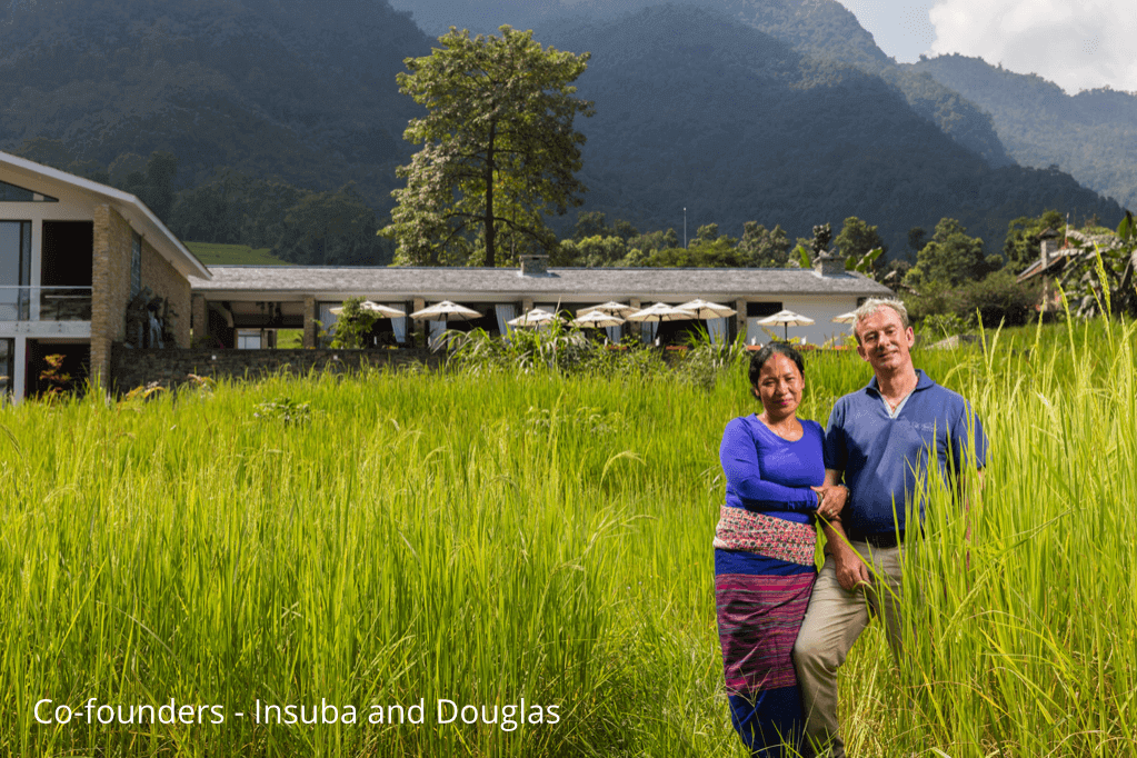 Insuba and Douglas Maclagan, a married couple, stand in front of their eco-luxury resort in Nepal.