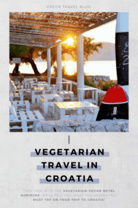 Sunlit outdoor dining area with white tables under pergola by the sea at the vegetarian and sustainable Hotel Korinjak, against a backdrop of trees and hills at sunset. Text reads "Vegetarian Travel in Croatia." Elegant and tranquil ambiance.