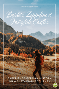 Traveler in autumn attire gazes at the distant fairy-tale castle of Neuschwanstein surrounded by vibrant fall foliage and mountains. Text reads, "Borders, Zeppelins & Fairytale Castles."